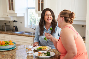 http://www.dreamstime.com/stock-photography-two-overweight-women-diet-eating-healthy-meal-kitchen-image47131532